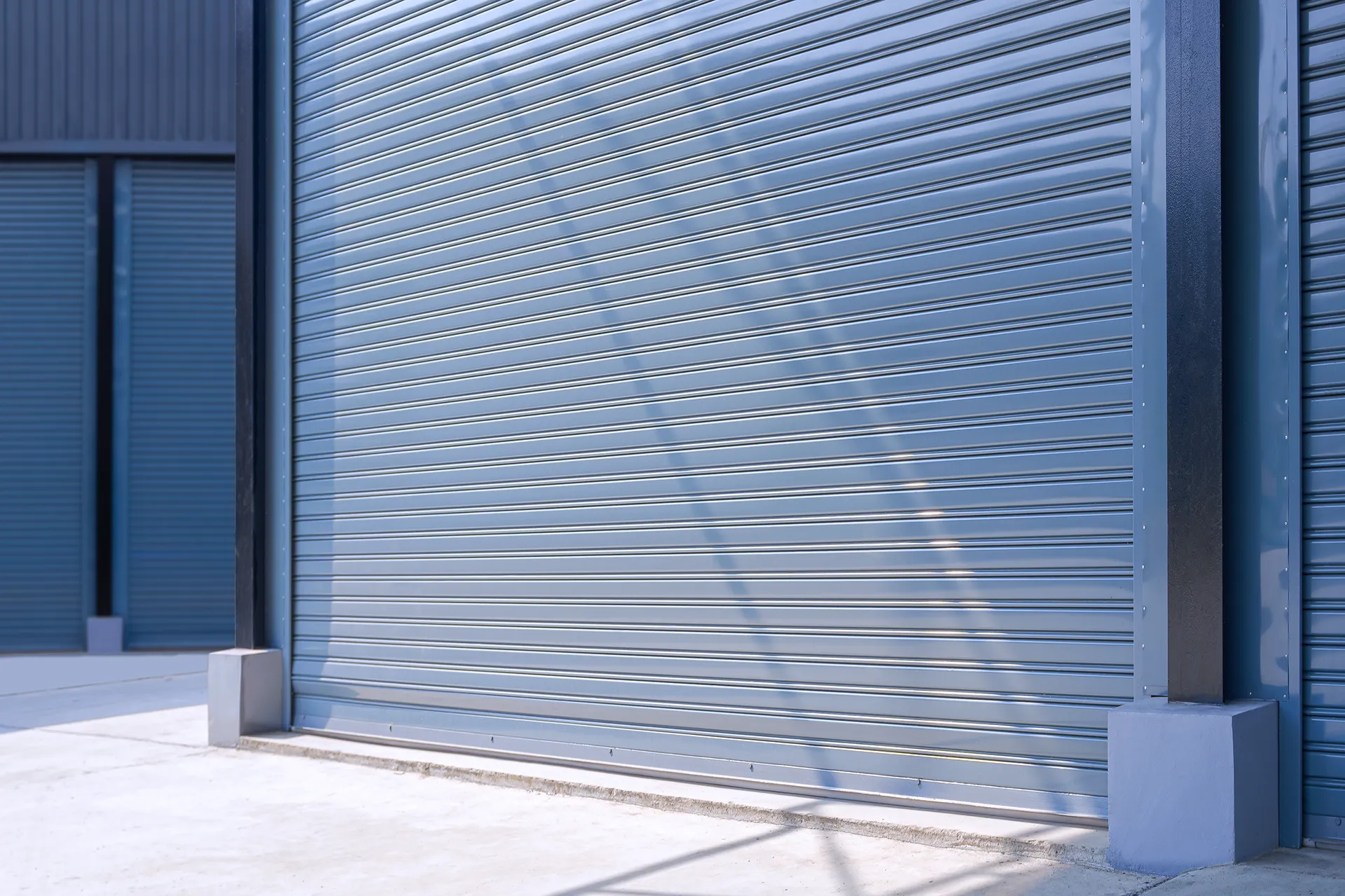 automatic-gray-roller-shutter-entrance-door-of-ind-2024-04-23-17-49-26-utc–